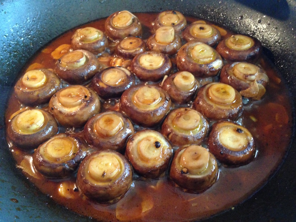 Mushrooms all lined up in the pan